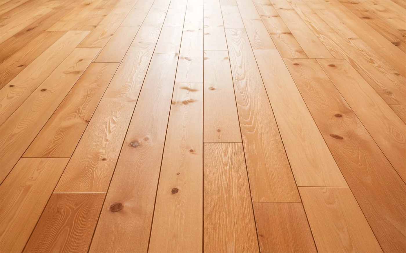 Wide plank oak floor running away from the camera, long boards with open grain and knots