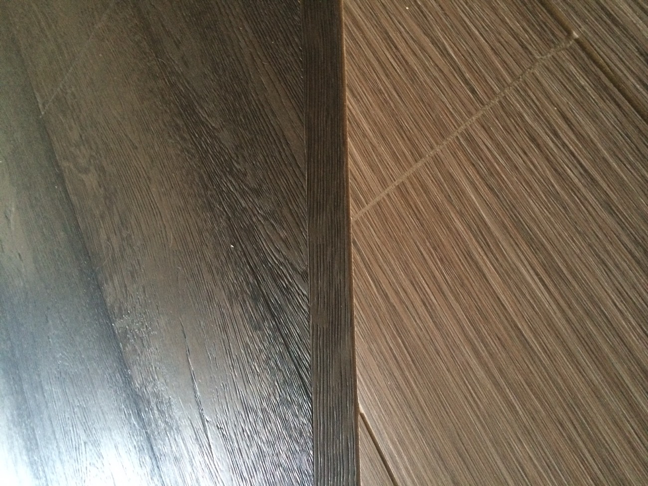 Flush transition where hardwood meets tile on a Phoenix jobsite