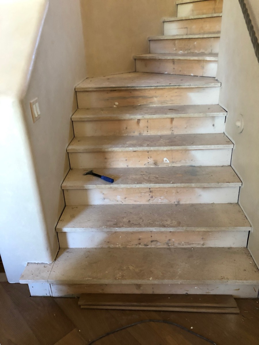 Staircase treads stripped back to bare wood during refinishing