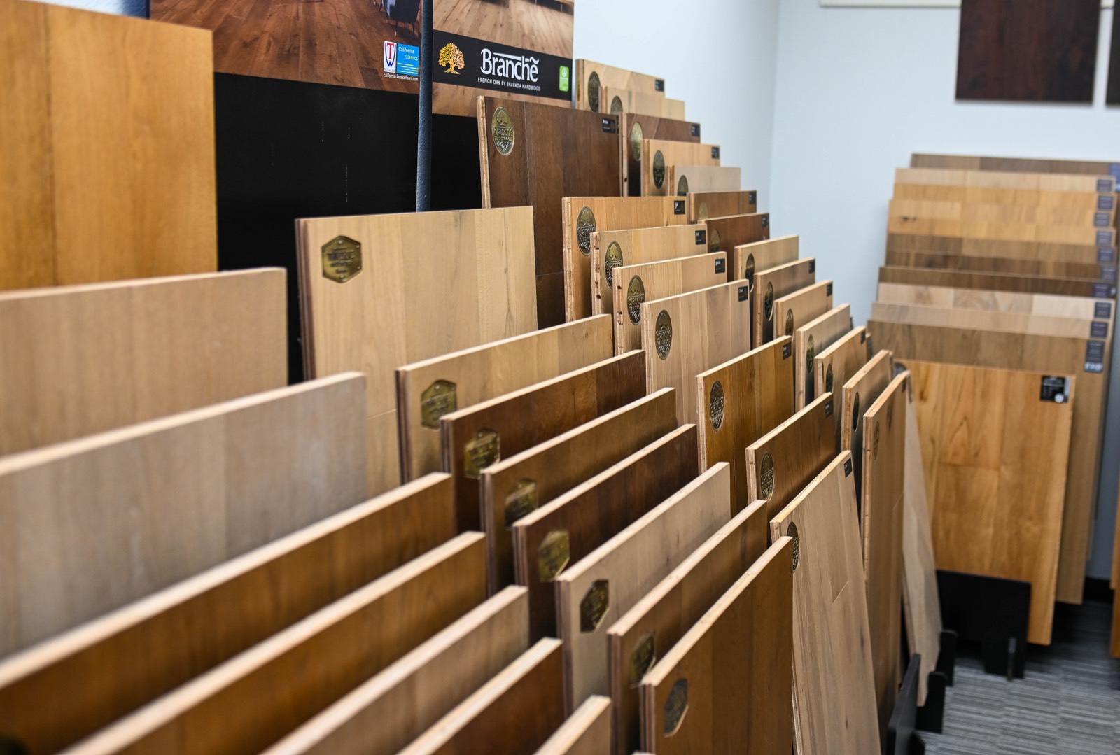 Pale and mid-tone French oak sample boards displayed side by side