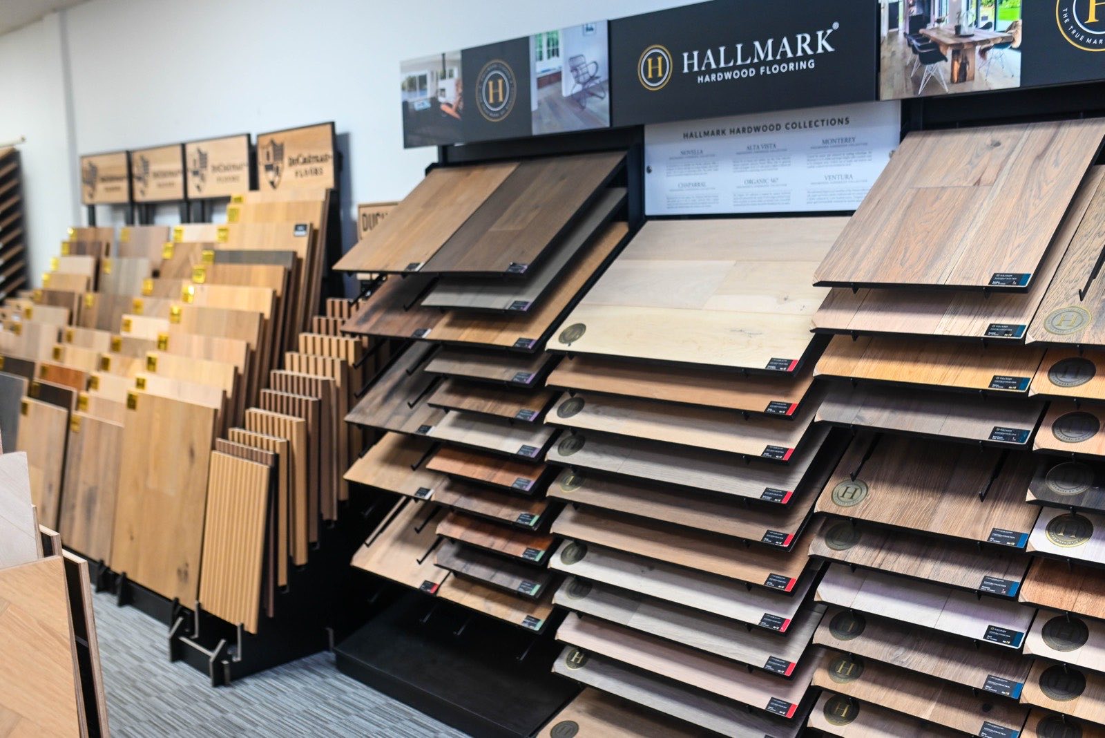 Hallmark Floors signage with collection samples beneath it