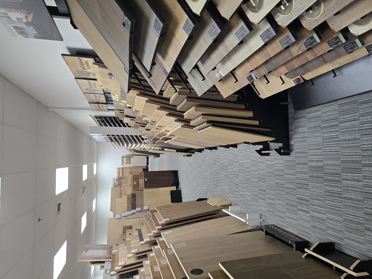 Hardwood samples in pale and mid tones on a display rack