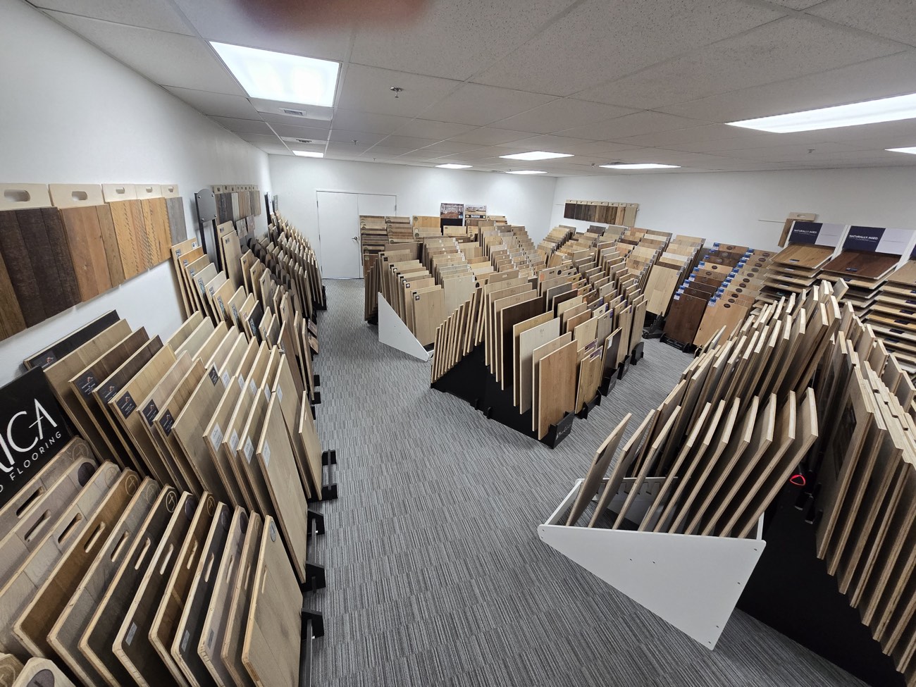 Sample racks and brand signage in the Phoenix showroom