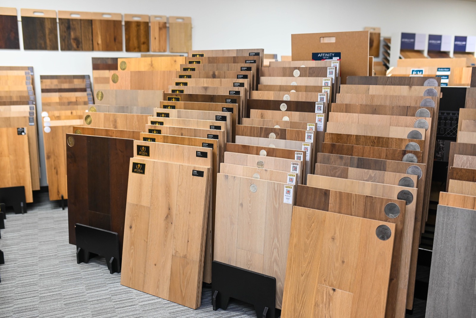 Wide French oak sample boards standing full width in a rack at the Phoenix flooring store