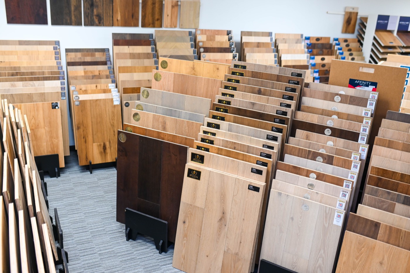 Rack of hardwood samples in the Phoenix flooring store showing pale through smoked tones